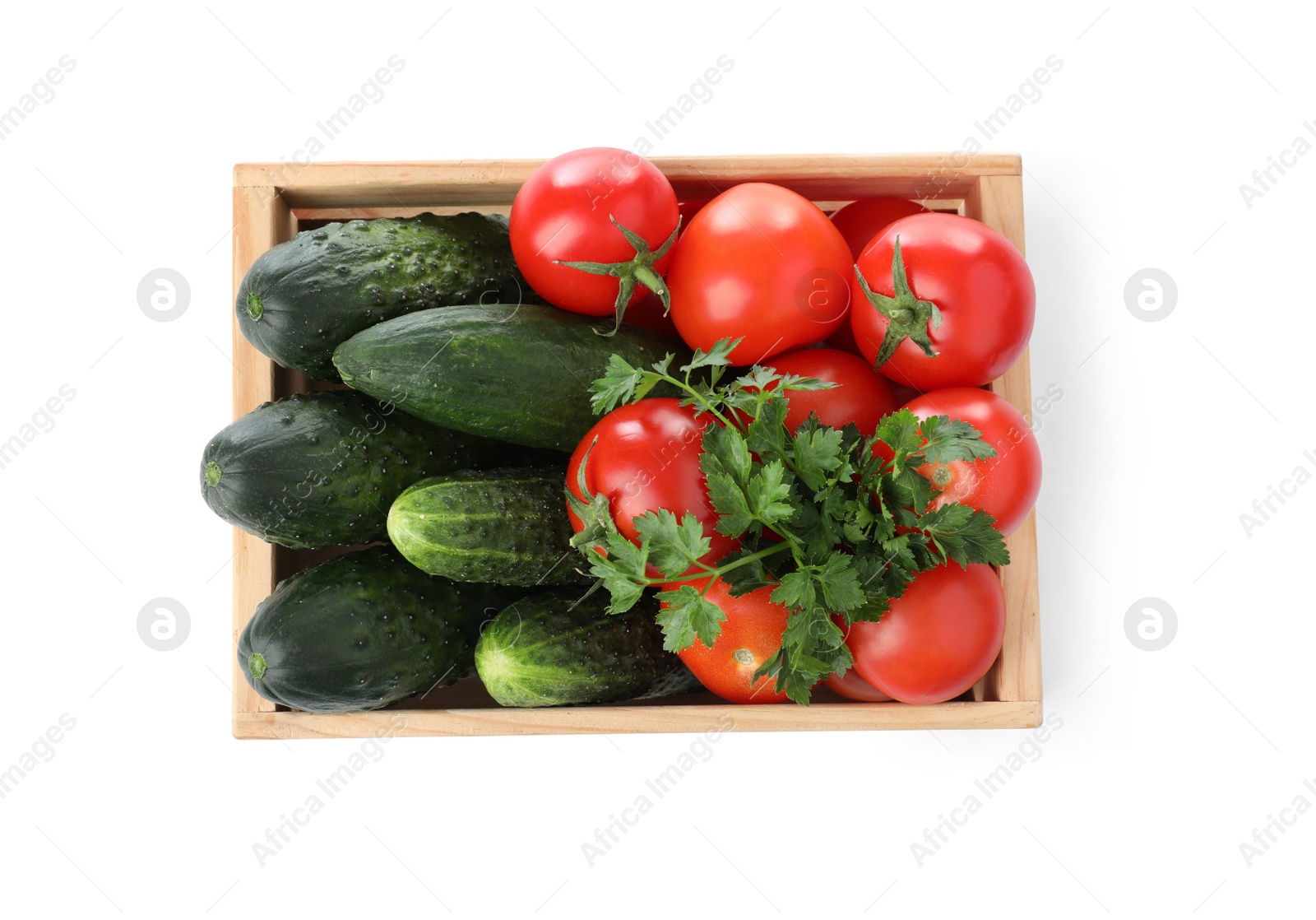 Photo of Wooden crate full of fresh vegetables on white background, top view