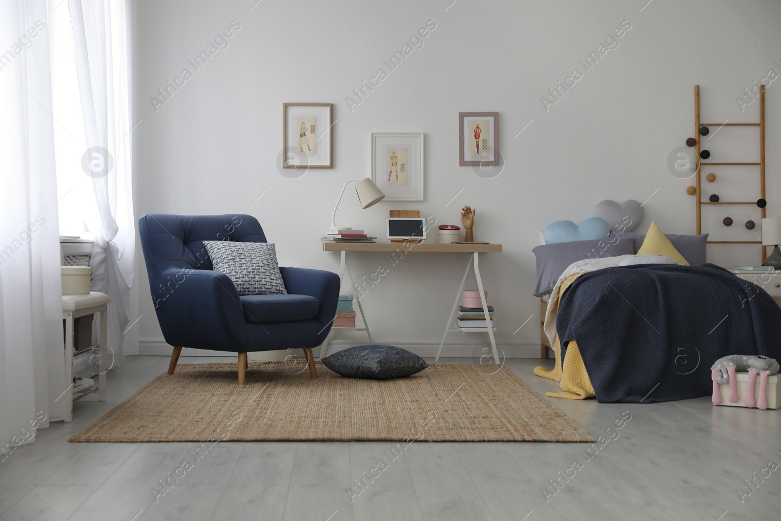 Photo of Modern teenager's room interior with bed and armchair