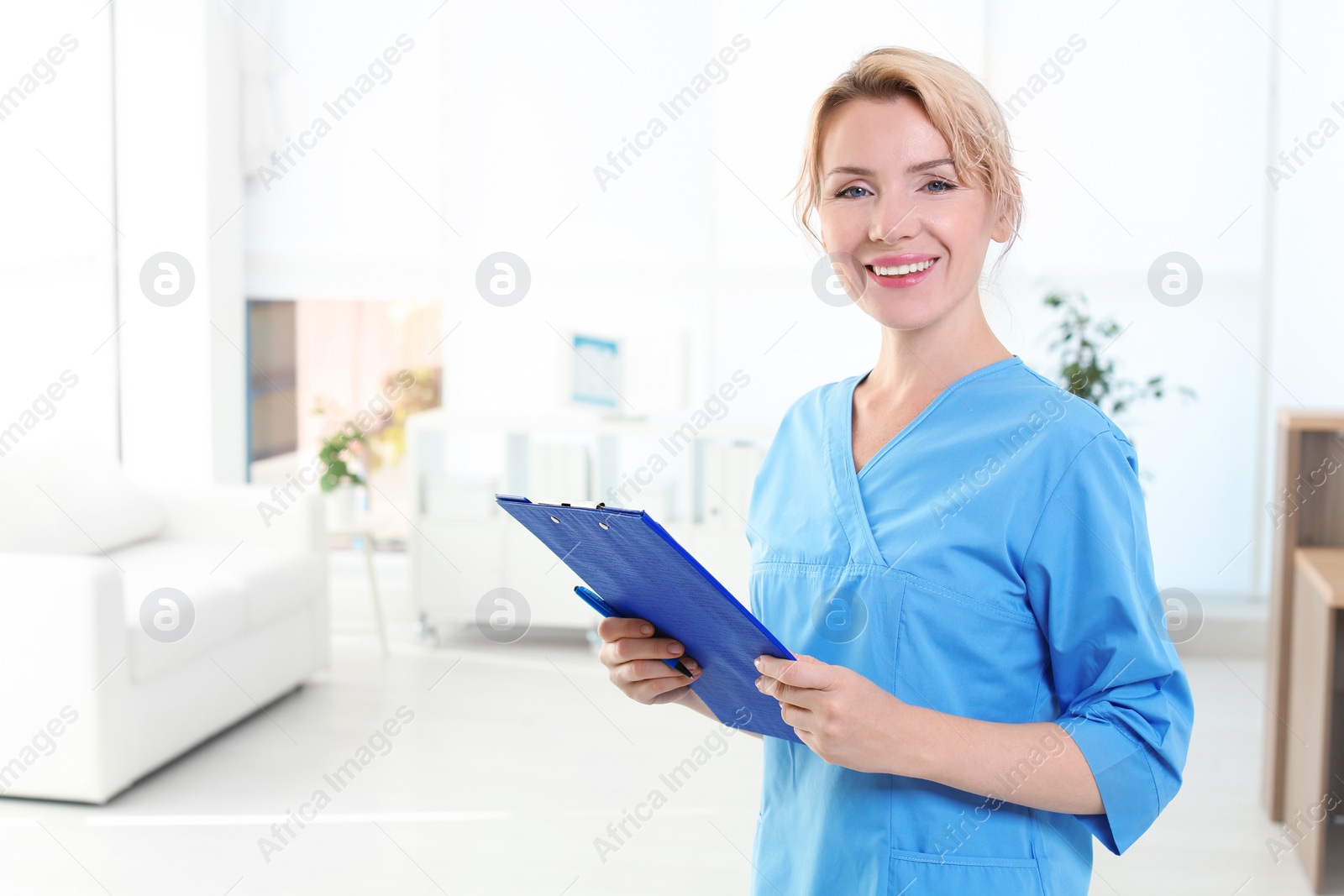 Photo of Female medical assistant in clinic. Health care service