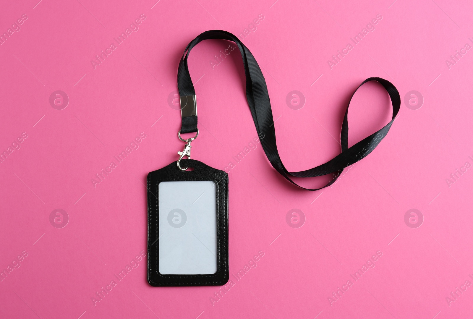 Photo of Blank badge on pink background, top view. Mockup for design
