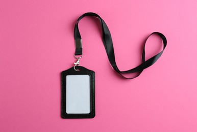 Blank badge on pink background, top view. Mockup for design