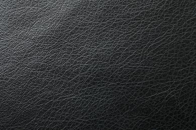 Texture of black leather as background, closeup