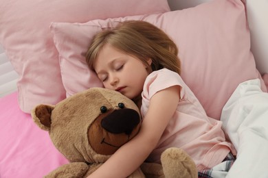 Photo of Little girl snoring while sleeping in bed