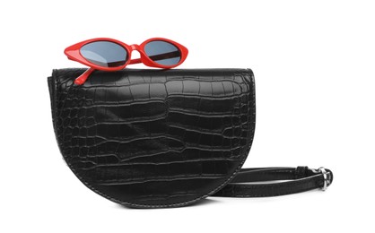 Stylish woman's bag and sunglasses isolated on white