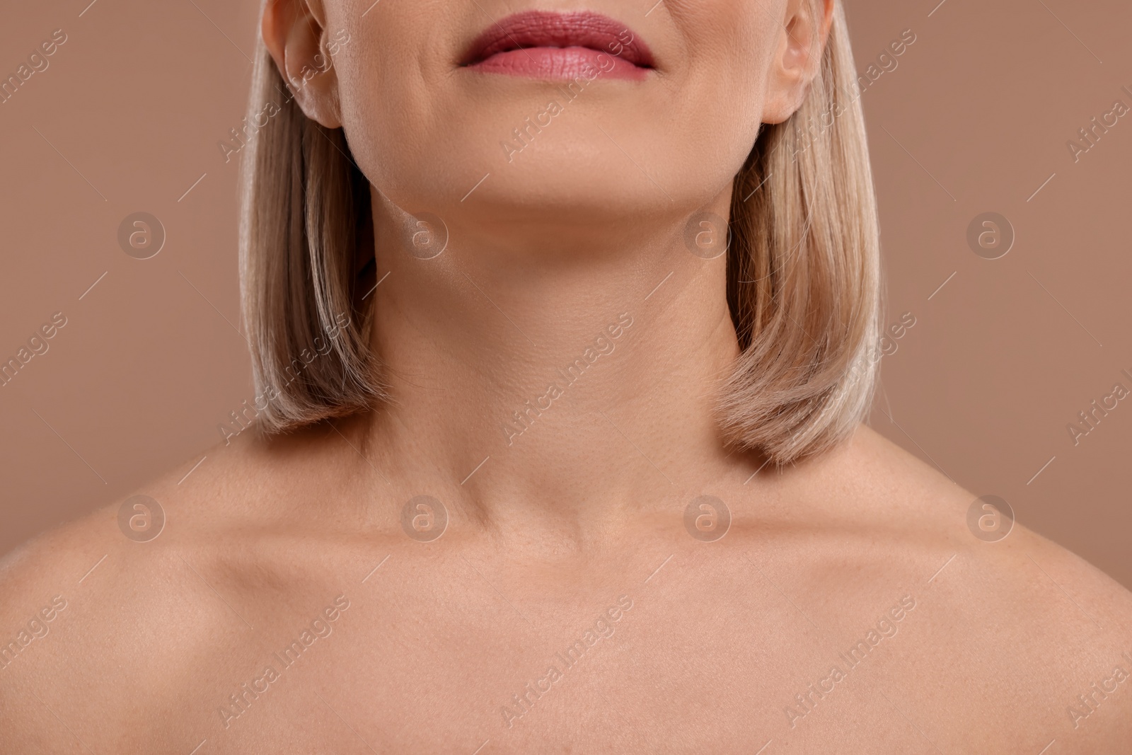 Photo of Woman with healthy skin on beige background, closeup