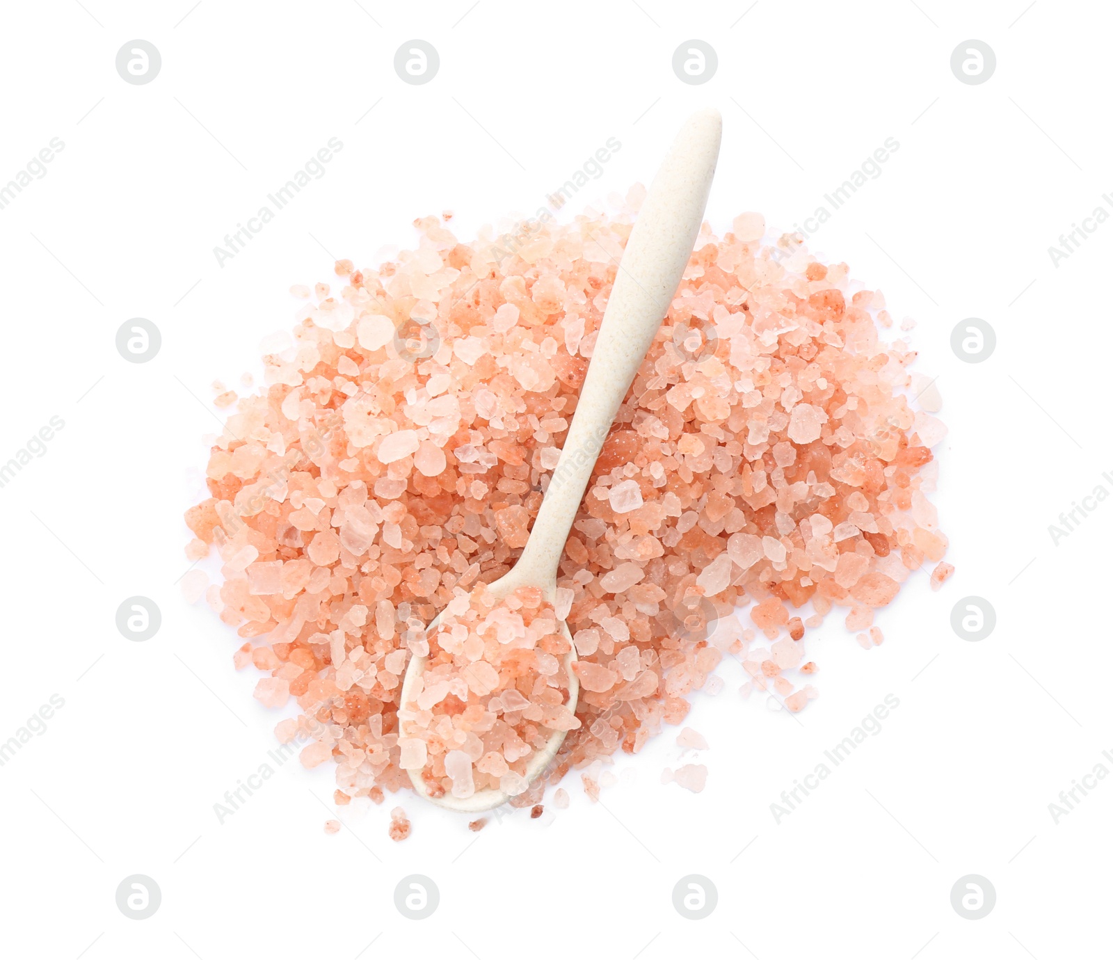 Photo of Pile and spoon of pink himalayan salt isolated on white, top view
