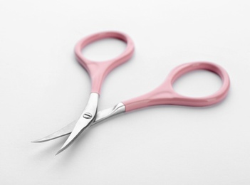 Photo of Pair of nail scissors on white background