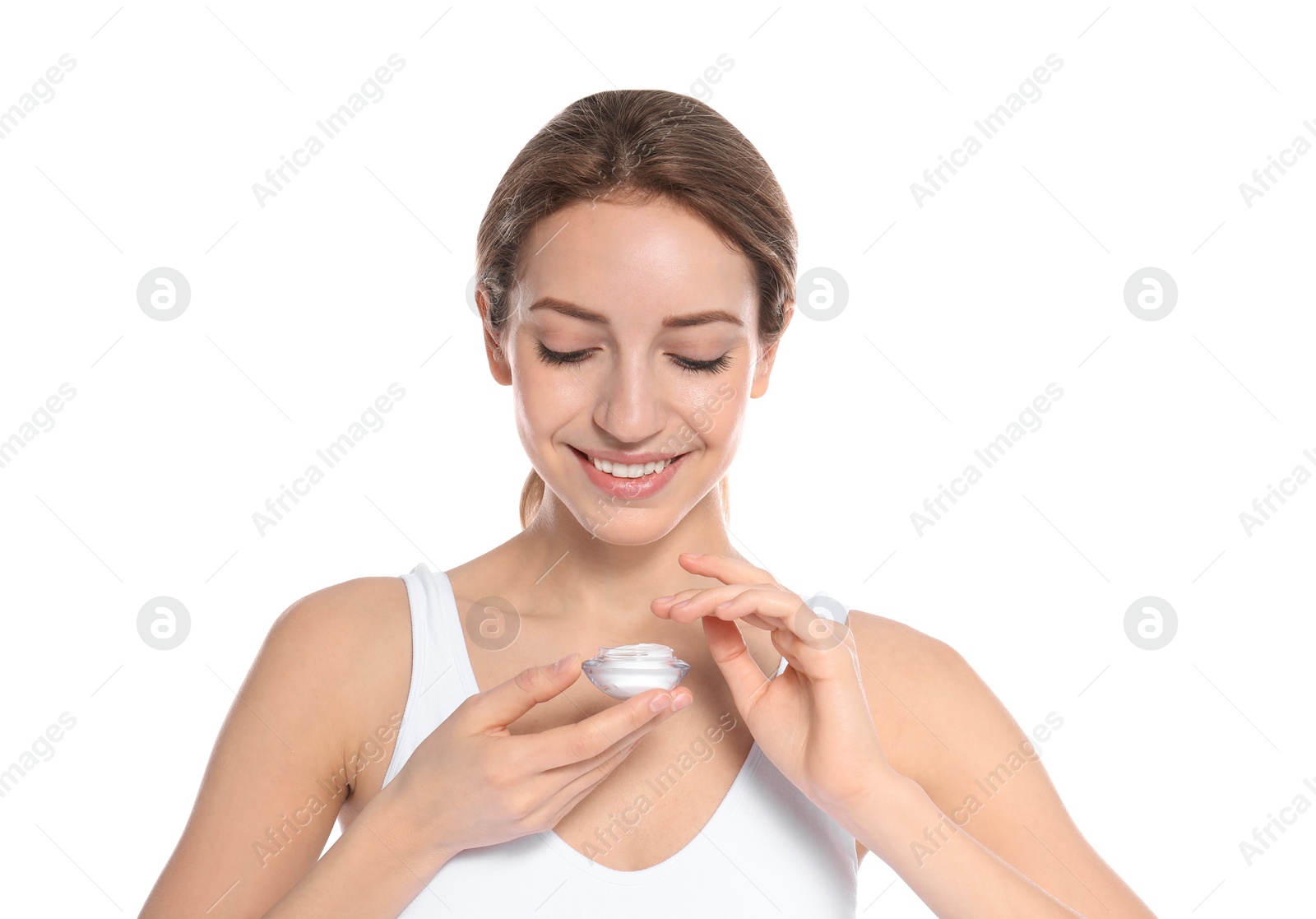 Photo of Portrait of young woman with jar of cream on white background. Beauty and body care