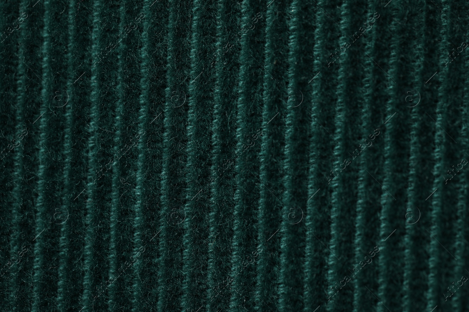 Photo of Texture of soft dark green knitted fabric as background, top view