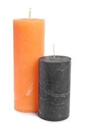 Photo of Two decorative wax candles on white background