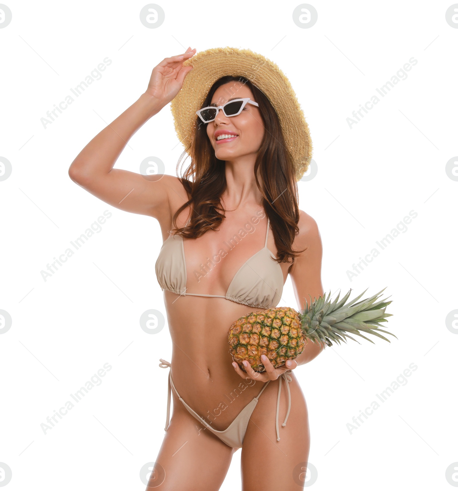 Photo of Beautiful woman in stylish bikini with pineapple on white background