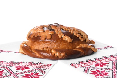 Photo of Rushnyk with korovai on white background. Ukrainian bread and salt welcoming tradition