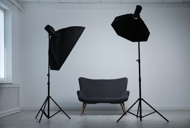 Photo of Modern photo studio with professional lighting equipment