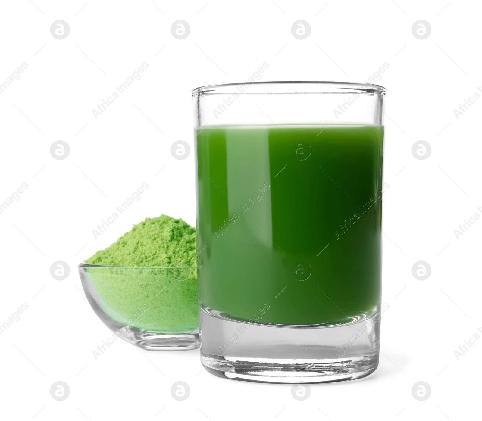 Glass of wheat grass juice and bowl with powder on white background Photo of Glass of wheat grass juice and bowl with powder on white background