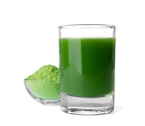 Photo of Glass of wheat grass juice and bowl with powder on white background