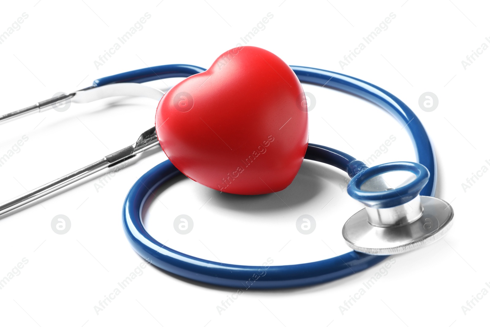 Photo of Stethoscope for checking pulse and red heart on white background