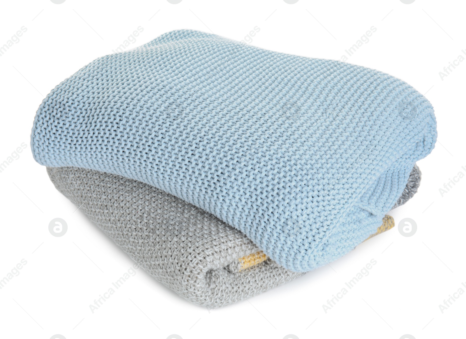 Photo of Different stylish knitted plaids on white background
