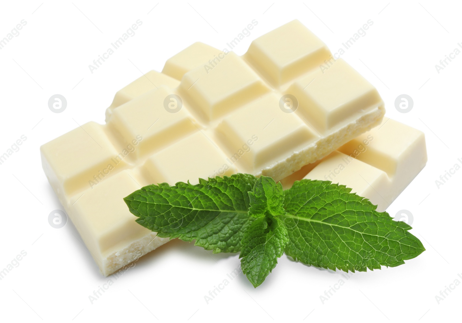 Photo of Pieces of white chocolate with mint on white background