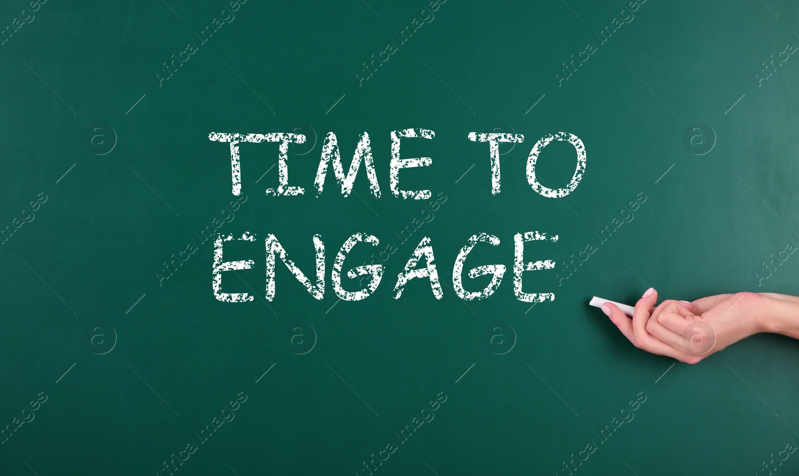 Image of Woman pointing at chalkboard with text Time To Engage, closeup