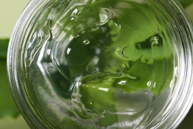 Photo of Aloe gel in jar, closeup. Cosmetic product