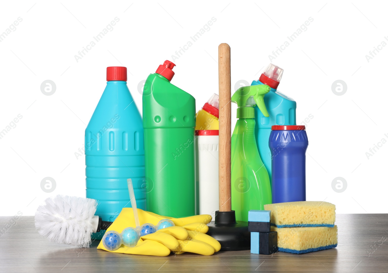 Photo of Different toilet cleaning supplies and tools on wooden table against white background