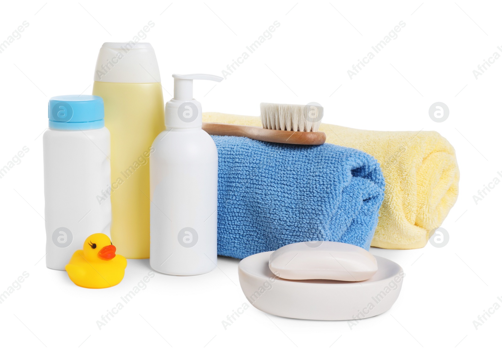 Photo of Baby cosmetic products, bath duck, brush and towels isolated on white