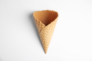 Empty wafer ice cream cone on white background, top view