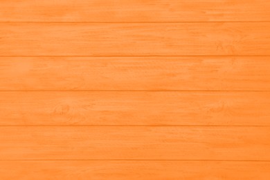 Image of Texture of orange wooden surface as background, top view