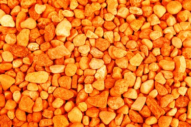 Image of Pile of orange stones as background, top view