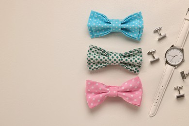 Photo of Flat lay composition with stylish color bow ties on white background. Space for text