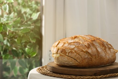 Freshly baked bread with tofu cheese on table indoors. Space for text