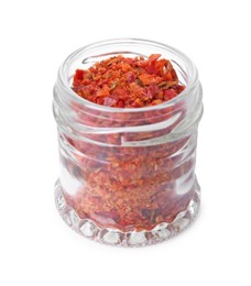 Photo of Aromatic spice. Red chili pepper flakes in jar isolated on white