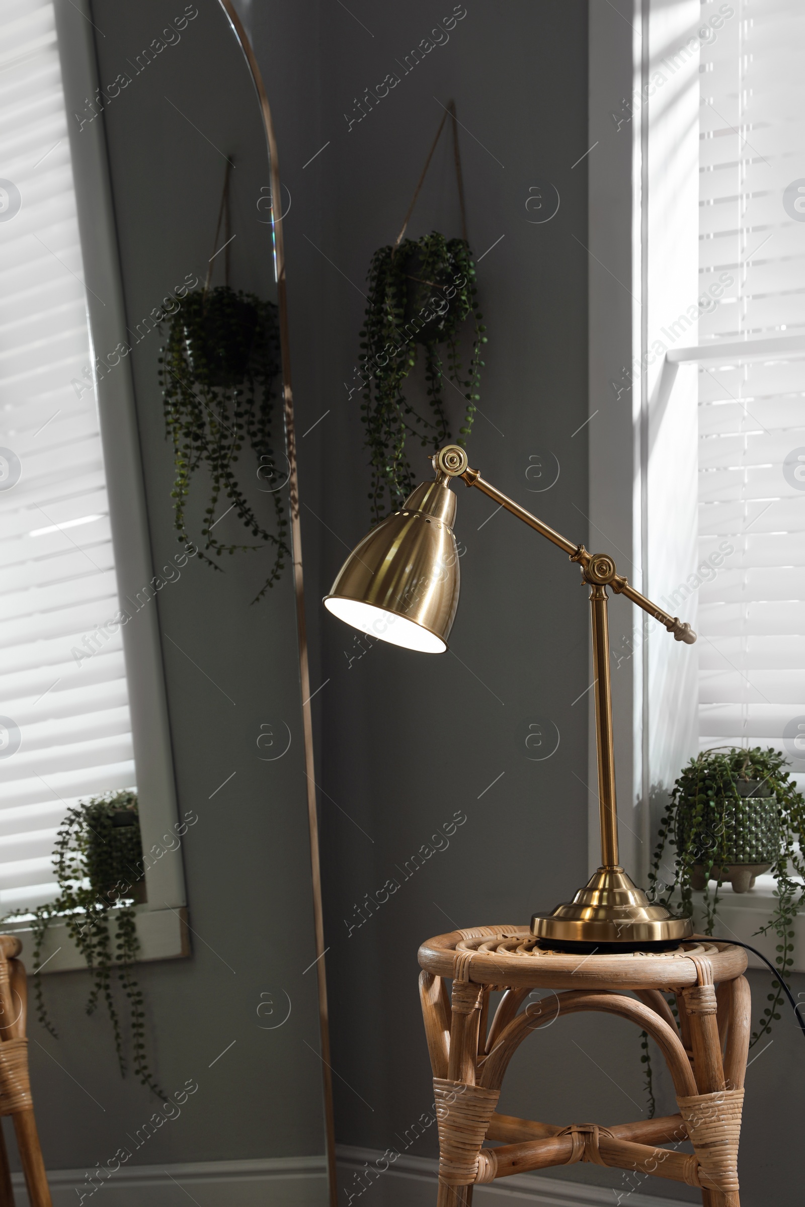Photo of Room interior with stylish lamp and mirror