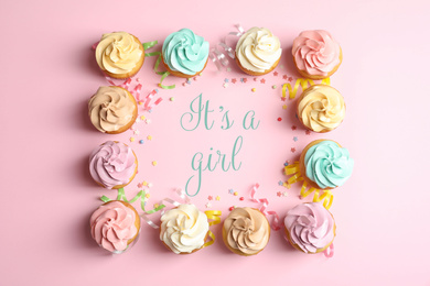 Image of Flat lay composition with baby shower cupcakes for girl on pink background