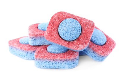 Photo of Many dishwasher detergent tablets on white background, closeup