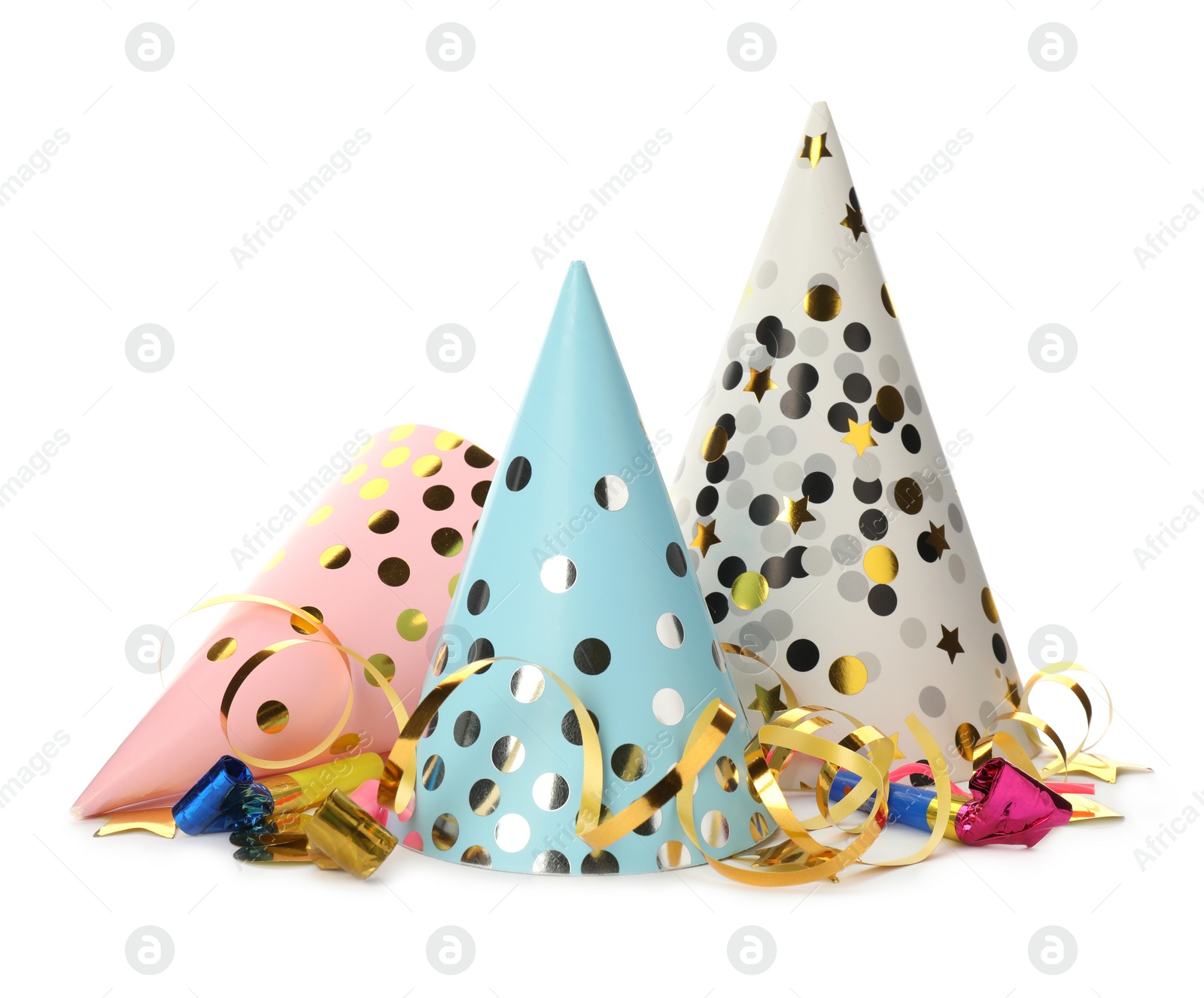 Photo of Colorful party hats, blowers and confetti streamers on white background