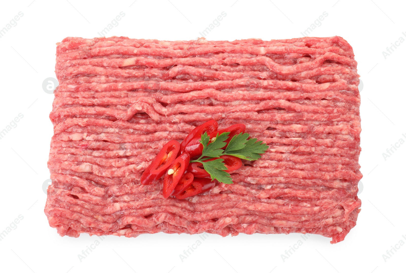 Photo of Raw ground meat, chili pepper and parsley isolated on white, top view