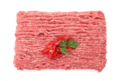 Raw ground meat, chili pepper and parsley isolated on white, top view