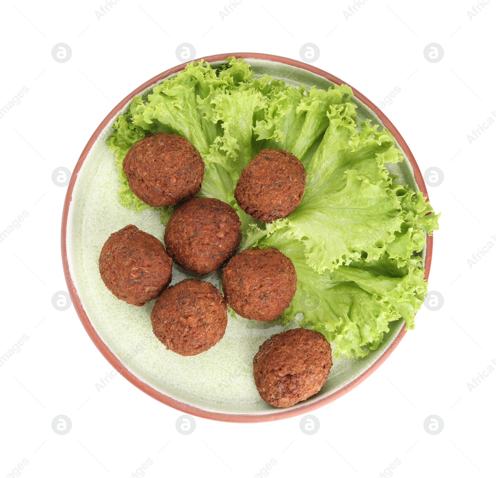 Photo of Plate of delicious falafel balls and lettuce isolated on white, top view. Vegan meat products