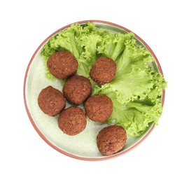 Plate of delicious falafel balls and lettuce isolated on white, top view. Vegan meat products