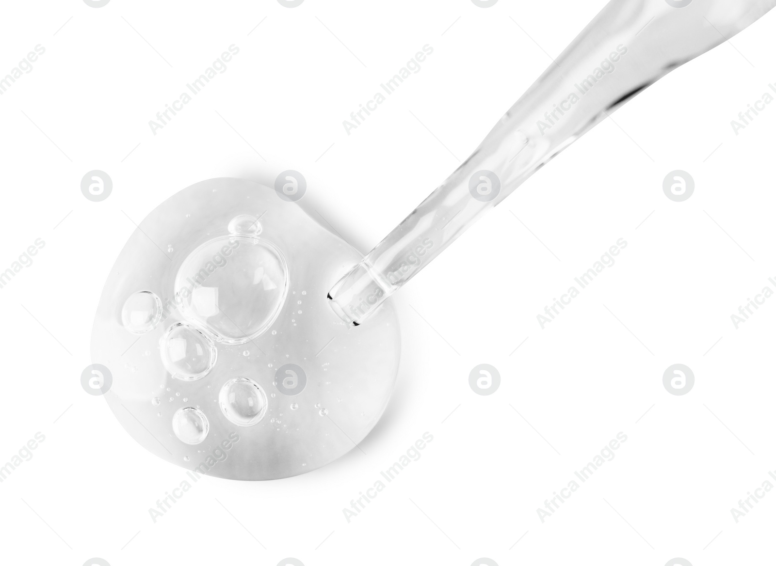 Photo of Glass pipette and transparent liquid isolated on white, top view