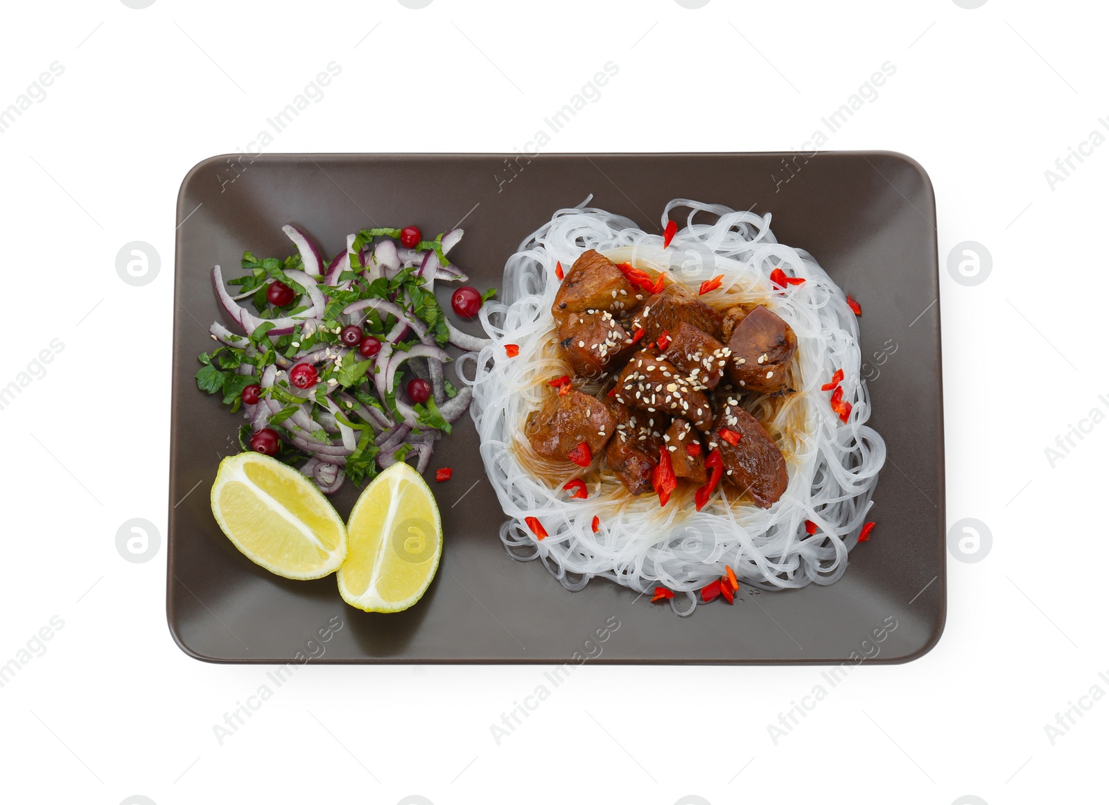 Photo of Pieces of soy sauce chicken with noodle, salad and lime isolated on white, top view