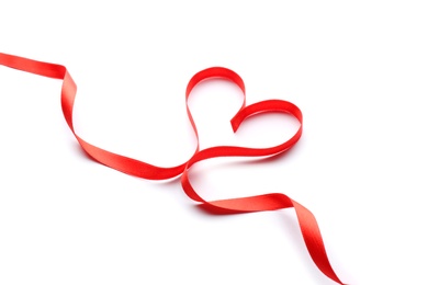 Photo of Heart made of red ribbon on white background. Festive decoration