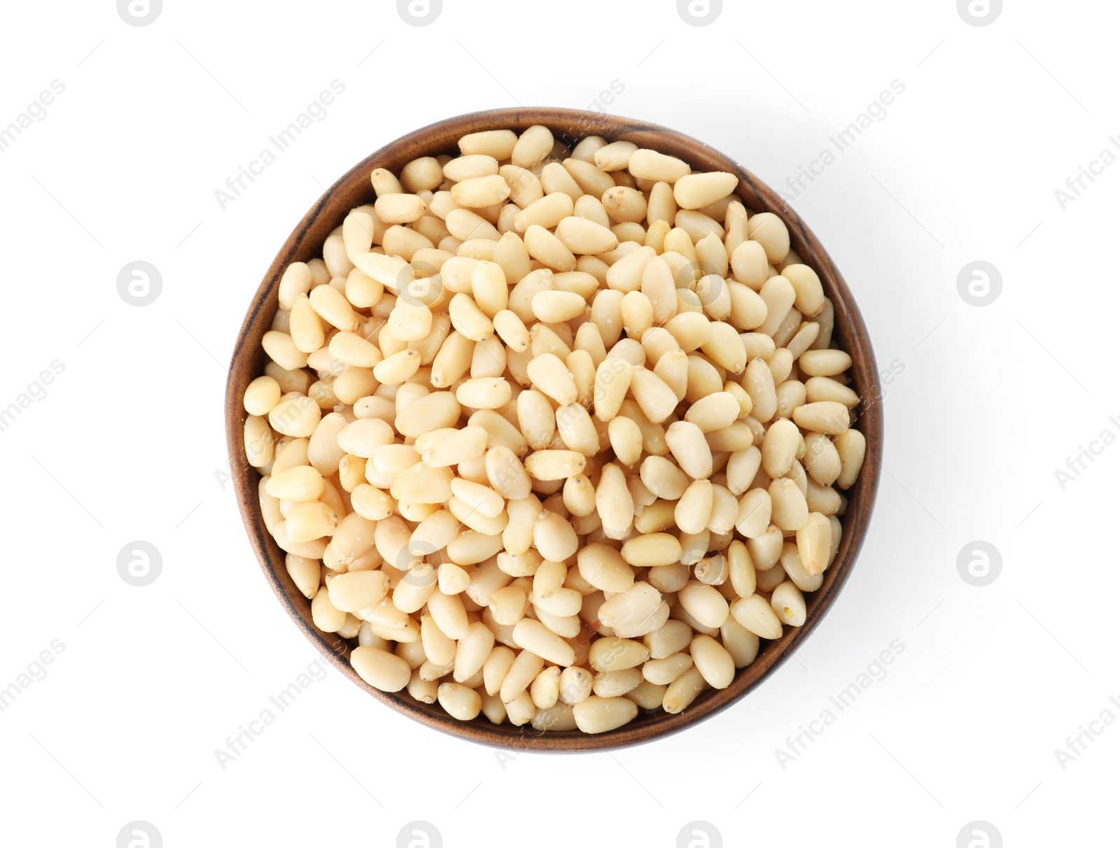 Photo of Bowl with pine nuts on white background, top view