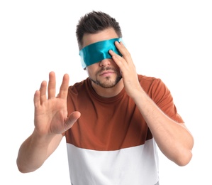 Photo of Man with light blue blindfold on white background