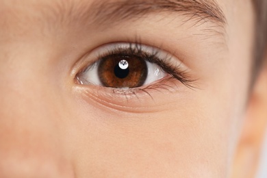 Little boy, focus on eye. Visiting children's doctor and ophthalmologist