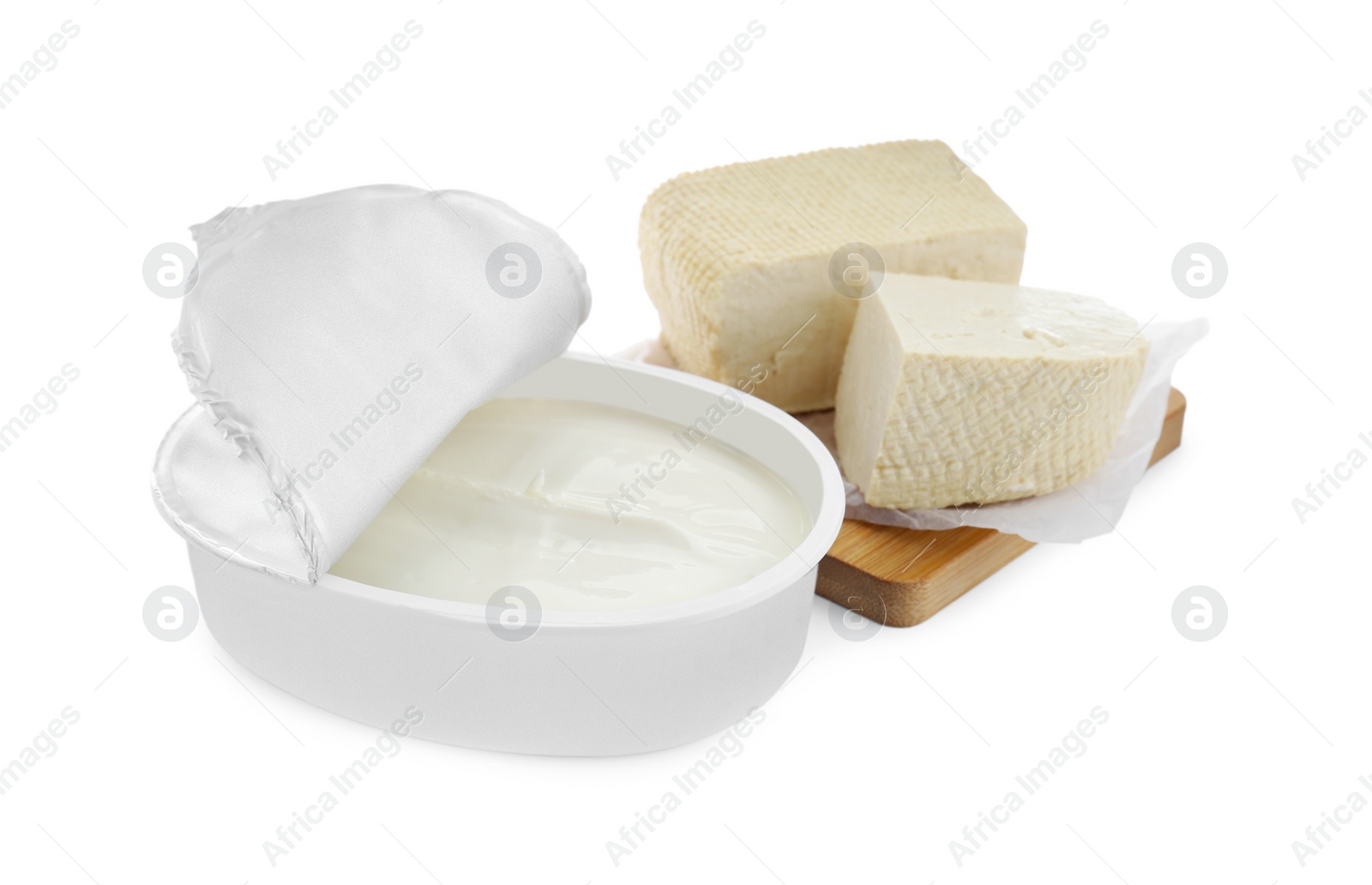 Photo of Tasty tofu and cream cheese on white background