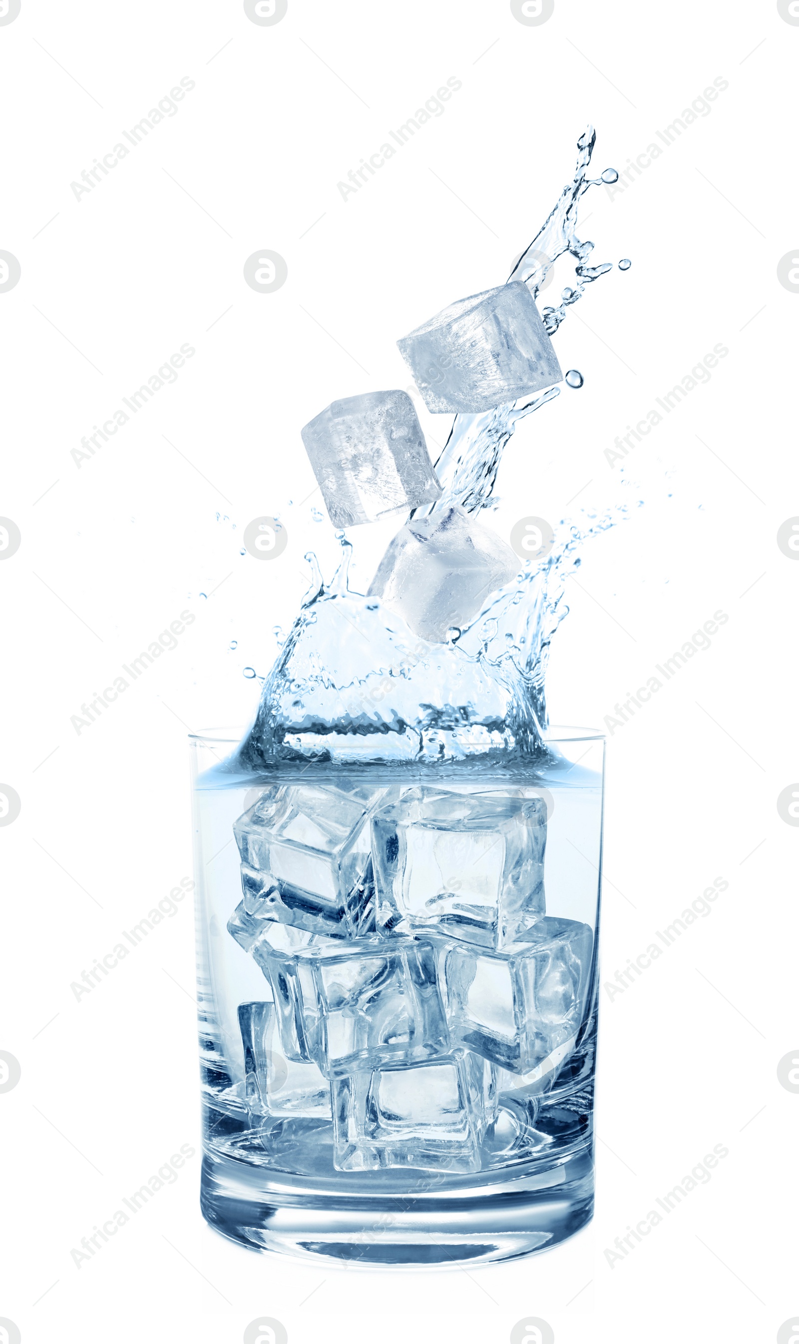 Image of  Water splashing out of glass with ice cubes on white background. Refreshing drink