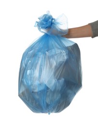 Photo of Woman holding trash bag filled with garbage on white background, closeup