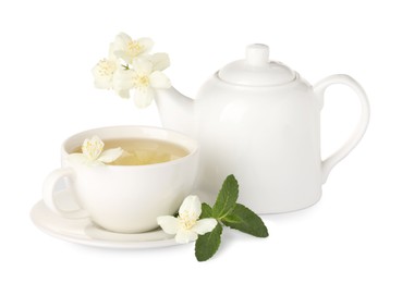 Photo of Aromatic herbal tea with mint and jasmine flowers isolated on white